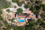 Pool, villa and terraces seen from drone